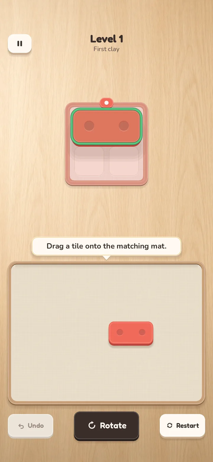Level 1: a coral tile dragged over the coral mat, outlined in green where it will land.