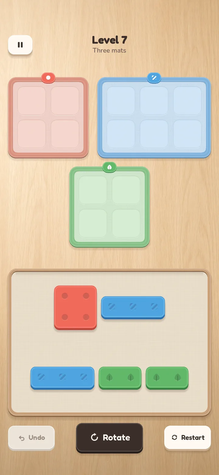 Level 7 'Three mats': coral, blue and green mats above a tray holding a square, an I, a domino and other tiles.