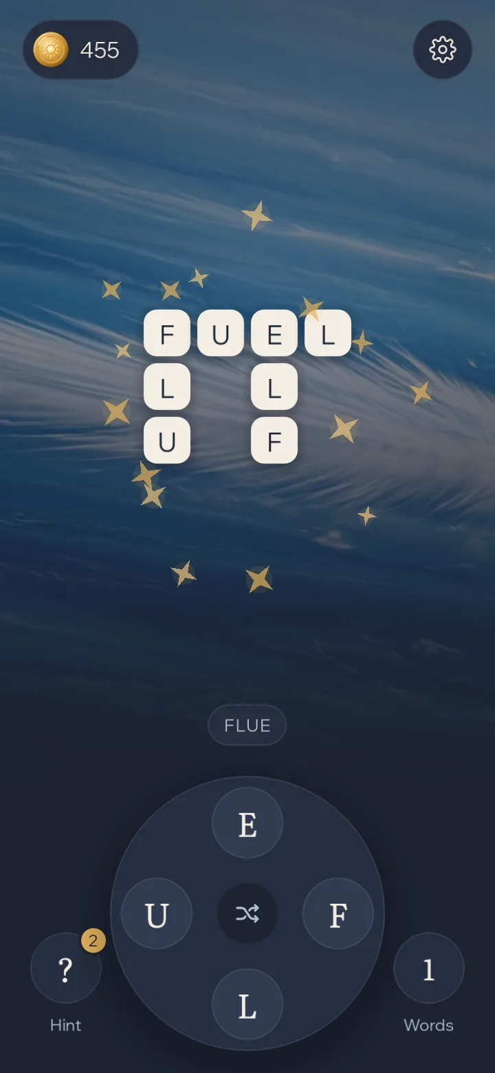 Gold stars bursting around a finished crossword in the Night theme.